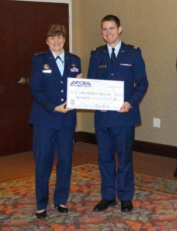 Gen. Wolfenbarger (l) presents a $500 Air Force ROTC scholarship to Cadet Sorenson in October.